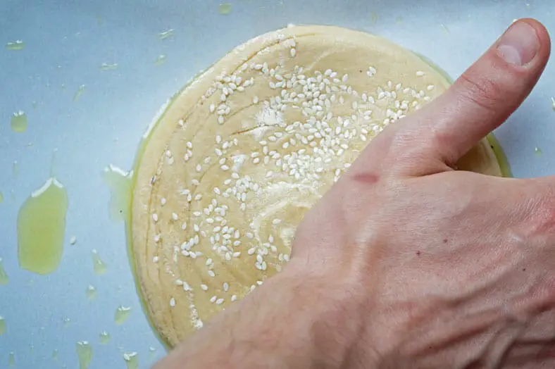 Evenly pressing edges of the dough 