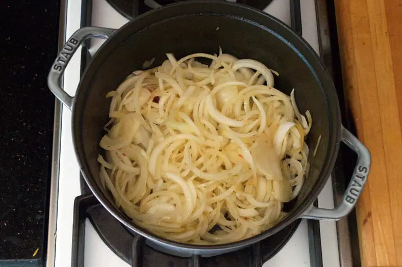 Sautéing golden brown onions in pot