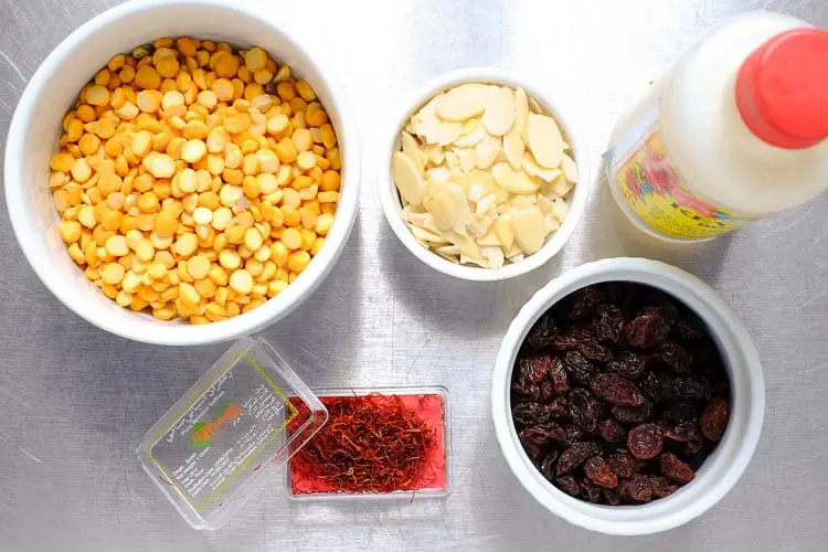 Ingredients for topping - soaked chana dal, raisins, saffron strands, rose water, peeled almonds