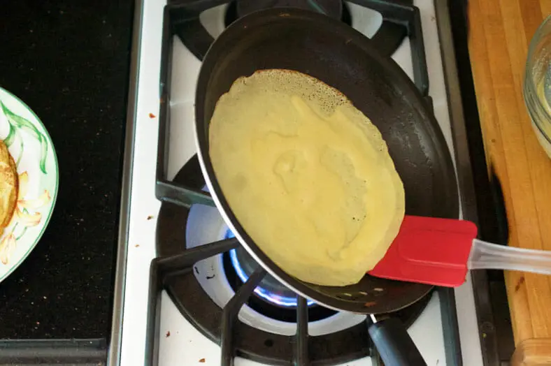 Flipping the pancake inside the pan