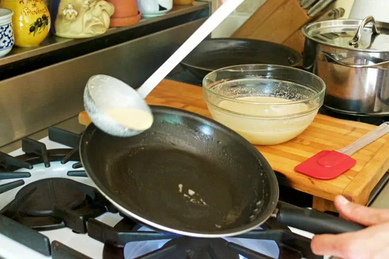 Adding batter to greased pan