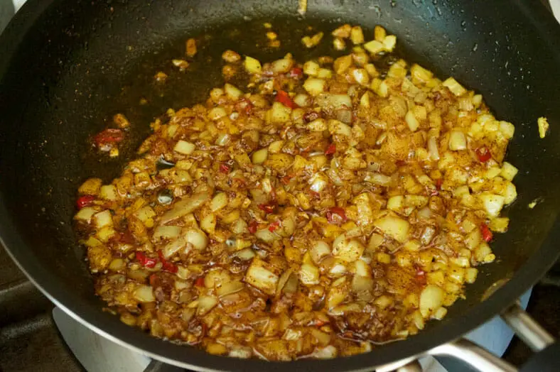 Simmering onion and spices for perfect taste