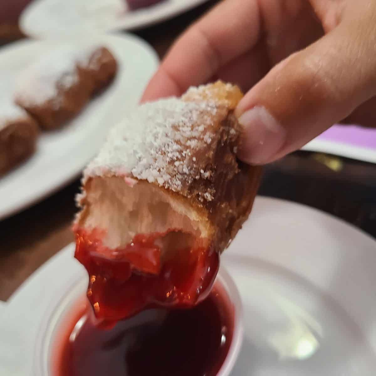 Beignets easy recipe dipped in raspberry sauce