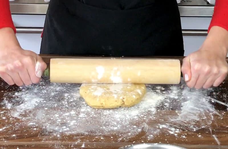 Rolling top crust with rolling pin
