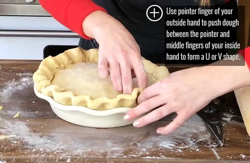 Pushing dough with pointer fingers for perfect pie shape