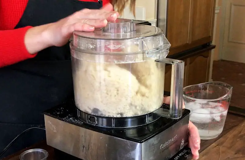 Pulsing water, flour and butter mixture to form a dough