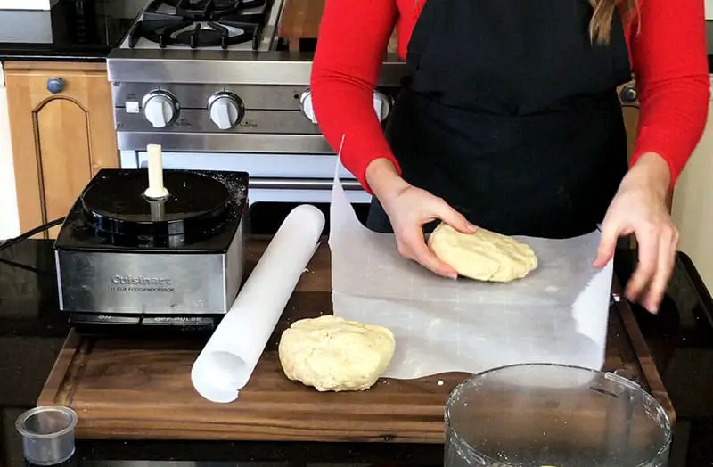 Wrapping plastic on 2 separated pie dough for refrigeration
