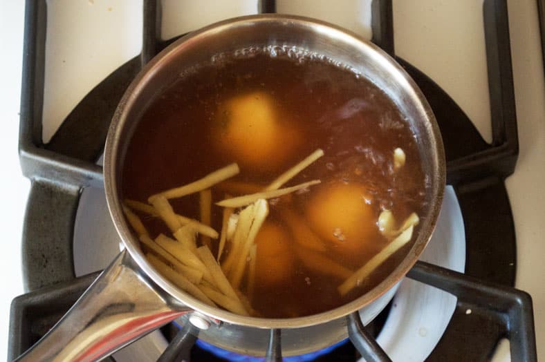 Cooking dumplings in ginger and sugar syrup