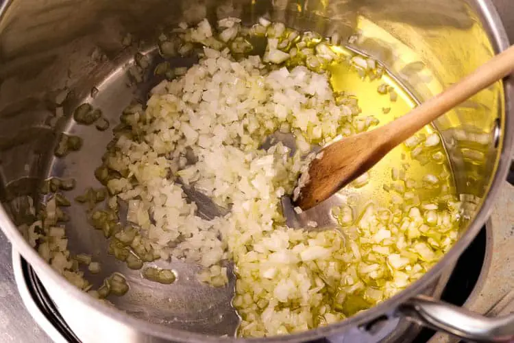 Cooking ingredients - chopped onions, olive oil in a pan