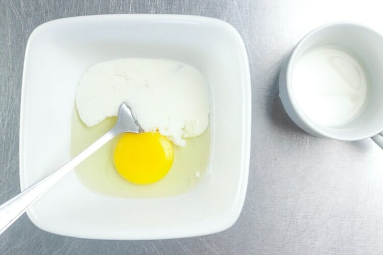 Whisking egg with a tablespoon of milk