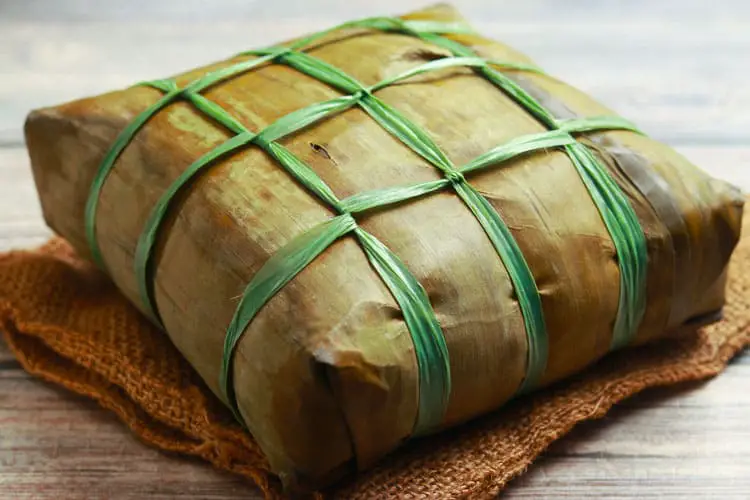 Fully cooked rice cake banana leaves parcel