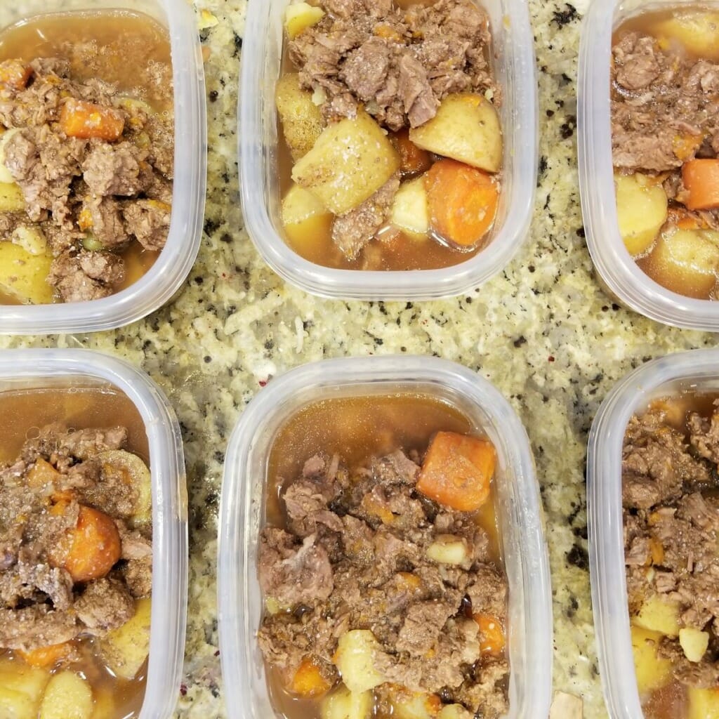 beef stew in individual plastic containers top view
