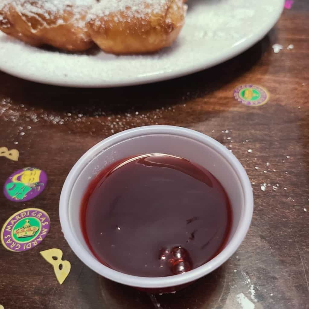 Strawberry dipping sauce in small plastic sauce cup
