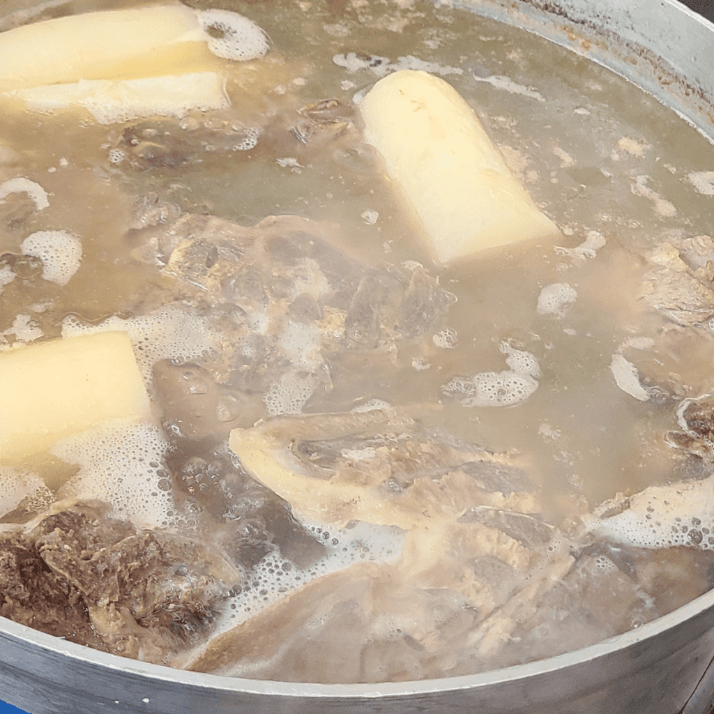 Simmering of Pho broth with bones and meat