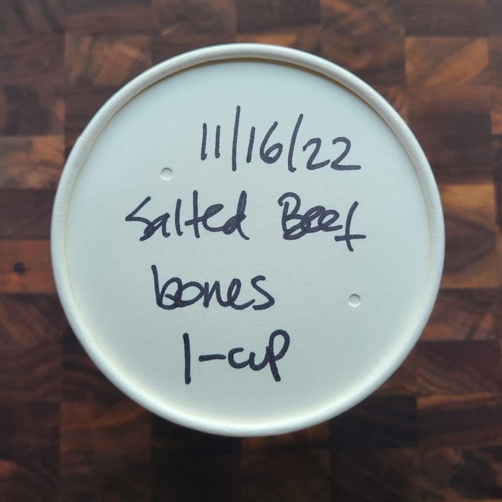 paper cup top view labeled with sharpie salted beef bones 1-cup 11/16/22