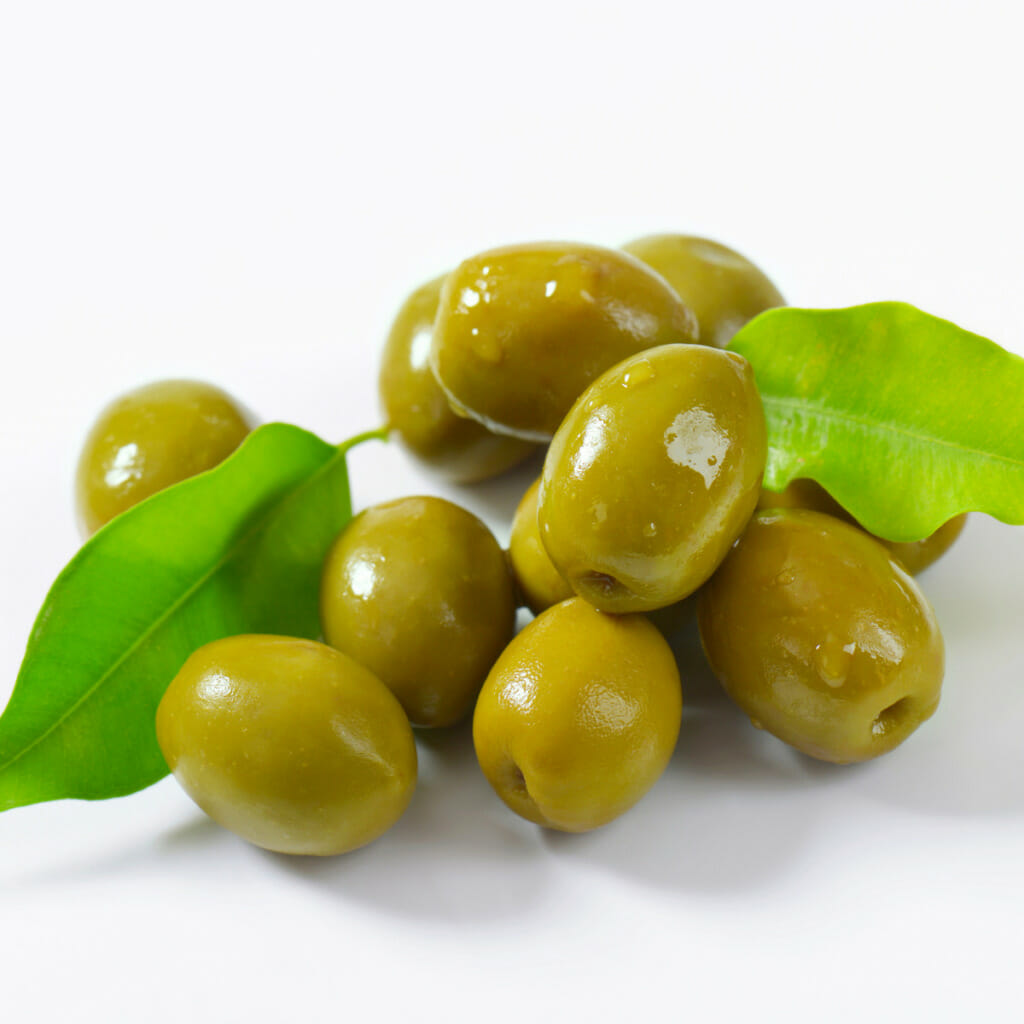 green olives and leaves on a stem