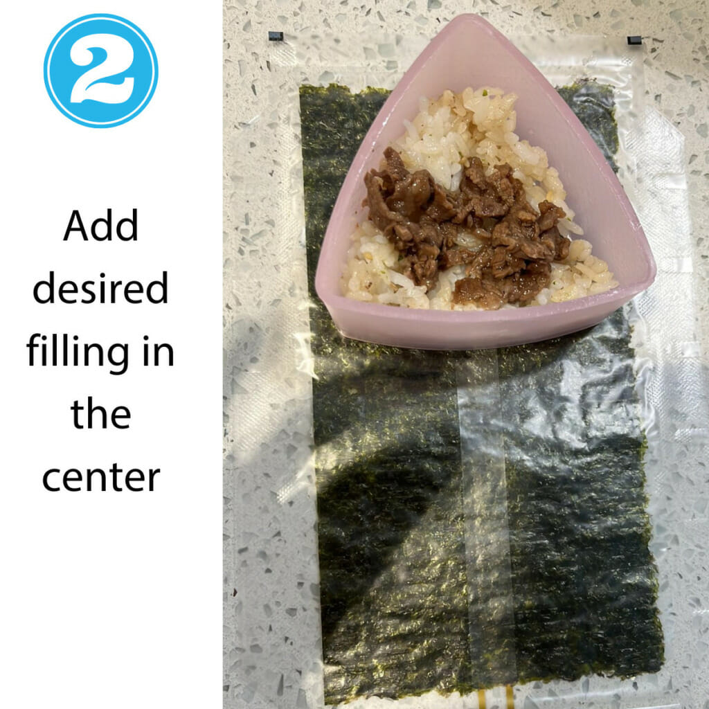 step 2 - add filling in the center of onigiri