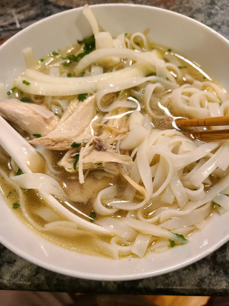 a bowl of chicken pho