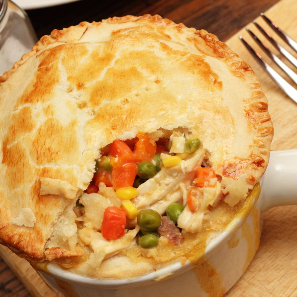  Chicken pot pie with fork on a table 
