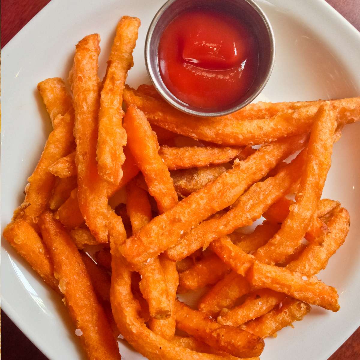 Crispy Sweet Potato Fries with Catchup in a plate