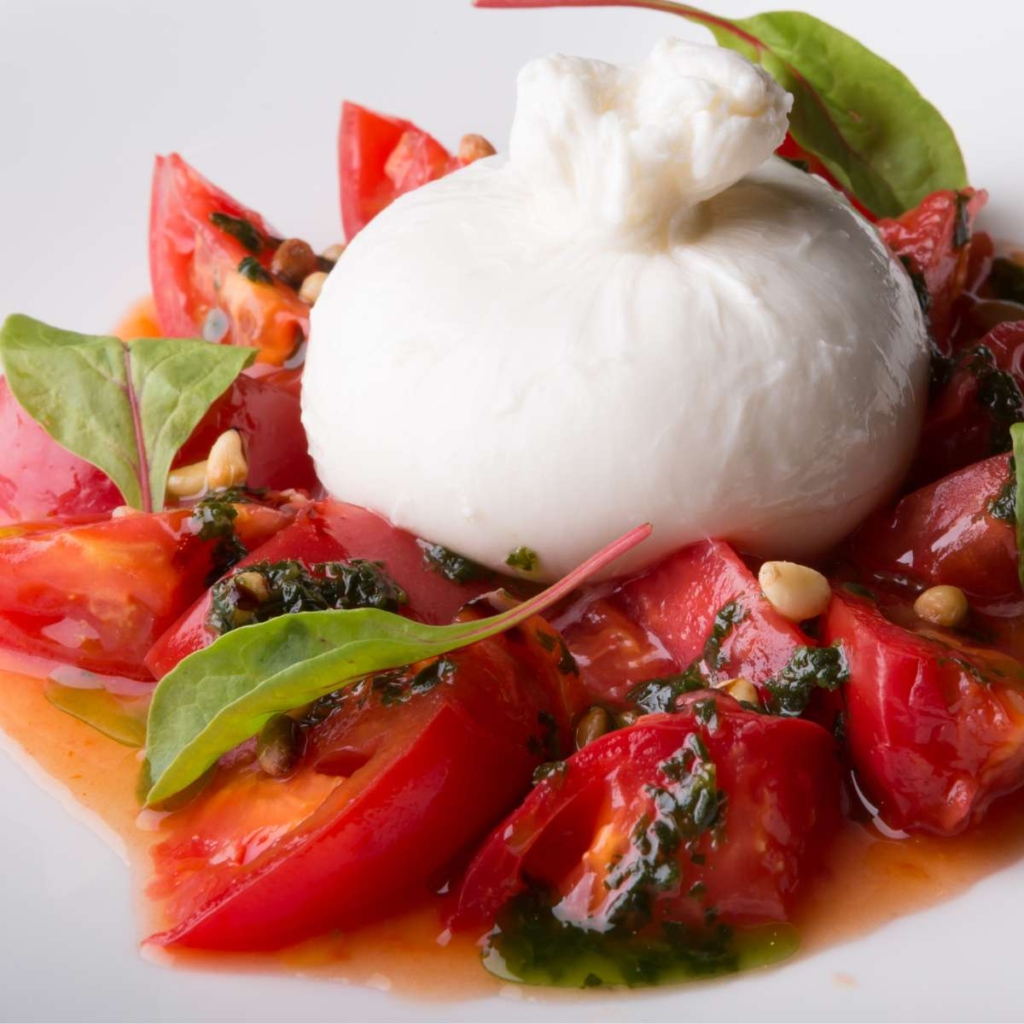 Burrata with tomatoes in plate
