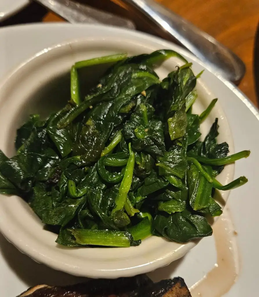 Spinach on a white bowl.